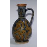 A Doulton Lambeth earthenware ovoid ewer, by Arthur B Barlow and Emma Martin, incised with stiff and