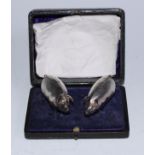 A pair of Edwardian silver novelty condiments, as pigs, salt and pepper, screw-fitting stoppers to