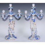 A pair of Dresden figural four light table candelabrum, leaf moulded sconces and drip pans, flower