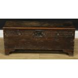 A '17th century' oak six plank chest, possibly Cornish, hinged cover, the front carved with