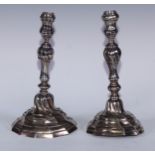 A near pair of Belgian silver wrythen fluted table candlesticks, knopped pillars, domed bases,
