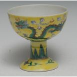 A Chinese stem cup, painted with dragons on a yellow ground, 10cm diam, 19th century