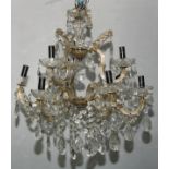 A glass nine light electrolier, faceted glass droplets and beads, 61cm high to fitting