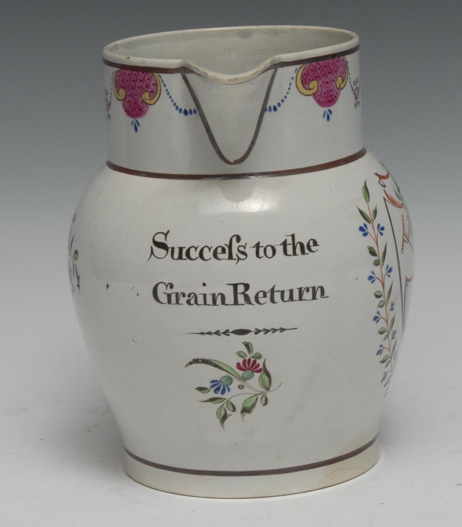 An early 20th century Pearlware jug, Success to the Grain Return, painted with a shield with farming - Image 2 of 2