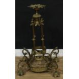 A large brass nine light ceiling chandelier, the tubular frame cast with acanthus leaves, lion masks