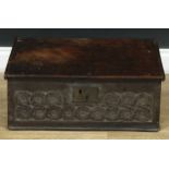 A 17th century oak boarded table box, hinged cover, the front carved with lemniscate knot motifs,