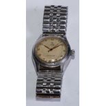 A 1940's-50's Tudor Rolex 7803 Oyster wristwatch, textured dial, gilt hands, centre seconds,
