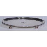 A George III Old Sheffield Plate oval salver, reeded border, ball feet, crested, 30cm wide, c.1800