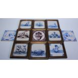 A collection of Delft tiles, various designs in blue and manganese, fanciful creatures, fish, and