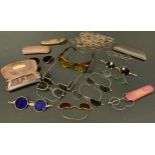 Glasses & Spectacles - a pair of tinted driving sun glasses, folding side pieces, sprung wire