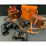 A pair of Le Maire Paris leather mounted binoculars; others Green Cat 10x50 field glasses; Tonelle