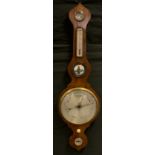 A George III Rosewood wheel barometer, silvered scales, 103cm high, 29.5cm wide.