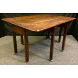 A large solid mahogany folding gate leg table, 106cm wide, 139cm long