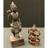 A 19th century Thai/Malayan carved wooden figure Hanuman standing, 31.5cm high; another Ganesh, 15.