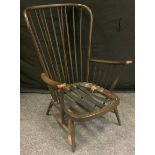 An Ercol Studio range stick back Armchair.