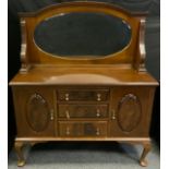 A Queen Anne style mahogany mirror back sideboard, an oval bevelled mirror, the slightly over