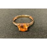 A Russian 14ct gold dress ring, claw set stone, the shoulders with diamond chips, 2.0g gross