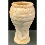 A large veined creamy white stone vase, possibly marble, floral ruff textured body beneath smooth