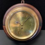 An early 20th century Barker's Kensington brass cases bulkhead timepiece, brass dial, Arabic