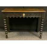 A 17th century style oak side table, rectangular top above a carved central short drawer, bobbin tur
