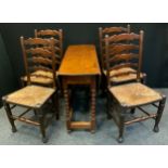 A set of four oak ladder back dining chairs, rush seats, turned legs; a 20th century oak drop-leaf