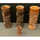 A pair of early 20th century Japanese (Bitong) brush pots, carved with pagodas and figures within