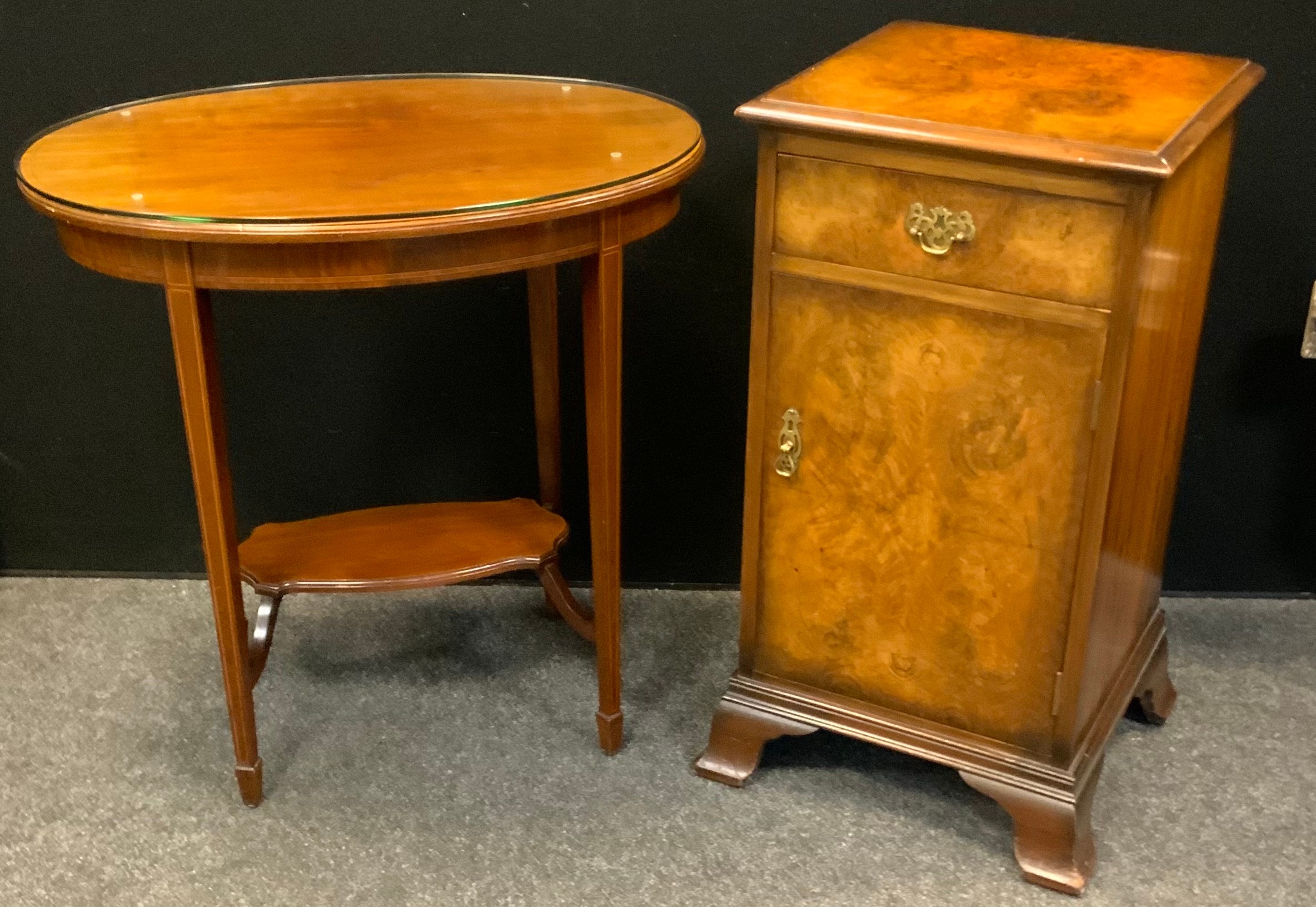 An Edwardian mahogany oval occasional table, boxwood stringing, 70cm high, 71cm wide, 50cm deep; a