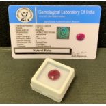 Loose Gemstones - a certified oval pinkish red ruby, 7.75ct, with GLI gem testing report card.