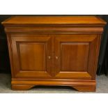 A contemporary Ernest Menard mahogany sideboard, rounded rectangular top above a pair of long