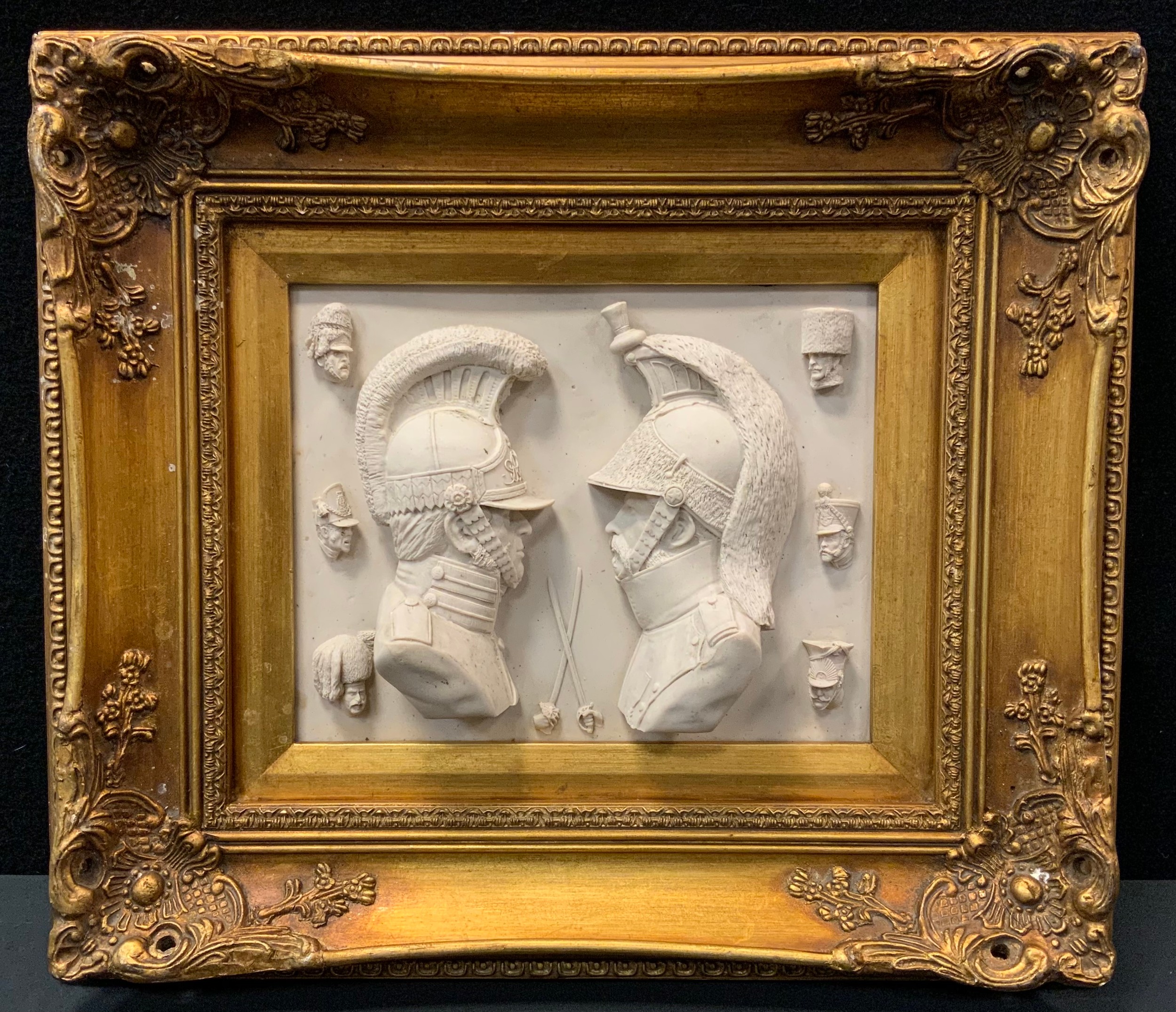 A neoclassical panel relief decorated with Military officers facing each others, crossed swords