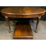 A Victorian mahogany oval dining table, carved cabriole legs with ball and claw feet, 151cm x