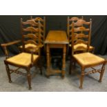 A set of four 19th century style oak ladder back dining chairs (three chairs plus one carver), and