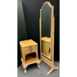 A mid 20th century lime-washed mahogany cheval mirror, 157cm tall; a similar bedside cabinet, 68cm