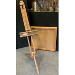 A wall mounted glazed display case, 84cm x 82cm; a large floor standing easel (2)
