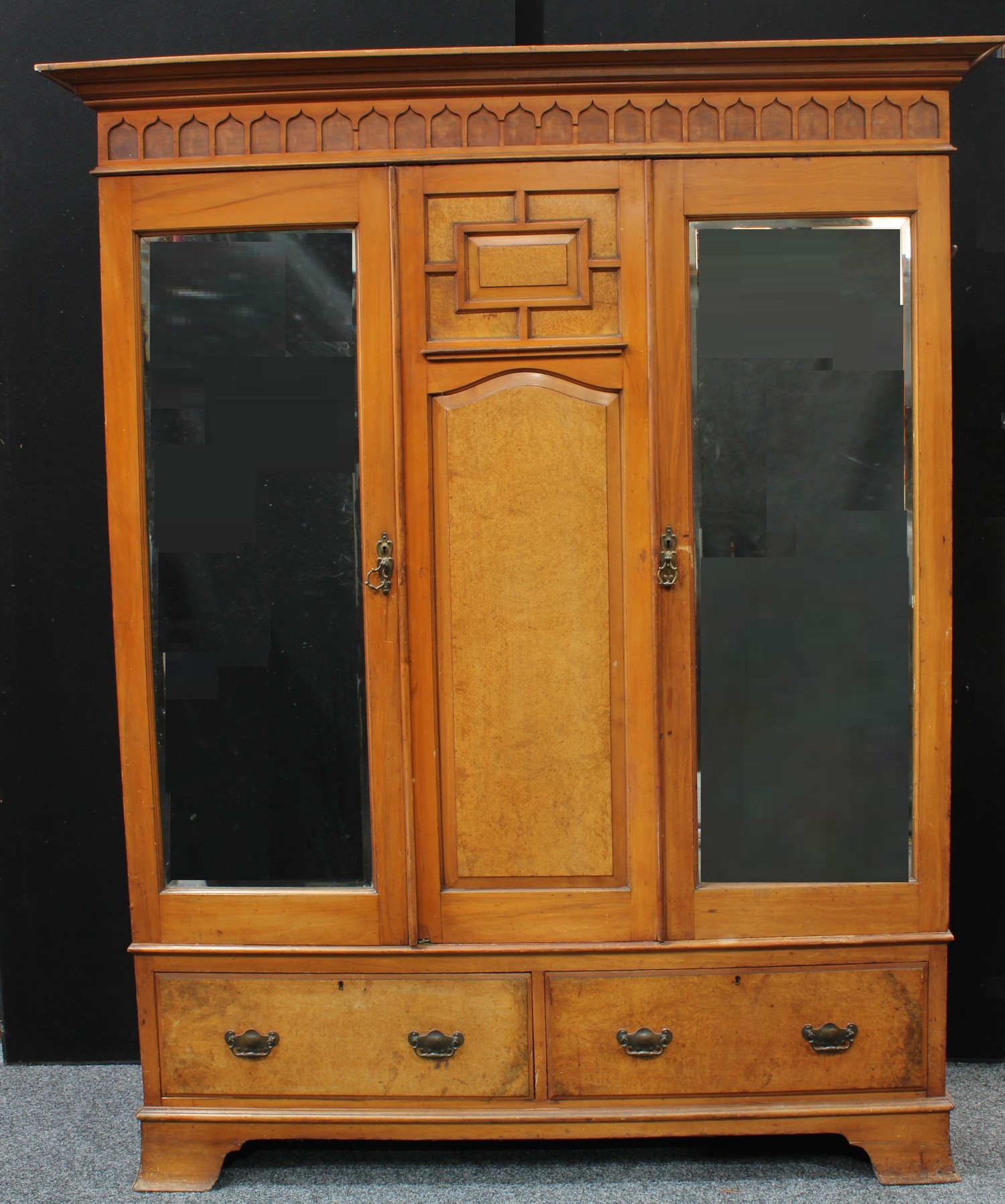 An Arts & Crafts period walnut accented two piece bedroom suite, comprising a triple-door wardobe - Image 2 of 2