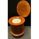 A 19th century mahogany cylinder commode, needle work top, with bucket, 47cm high, 42cm diameter