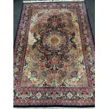 A fine, hand-made Tabriz rug / carpet, woven in shades of red, cream, and deep blue, 301cm x 201cm.