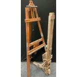 A mahogany A-frame artist's easel, 184cm tall; another artist's easel with built in palette, (2).