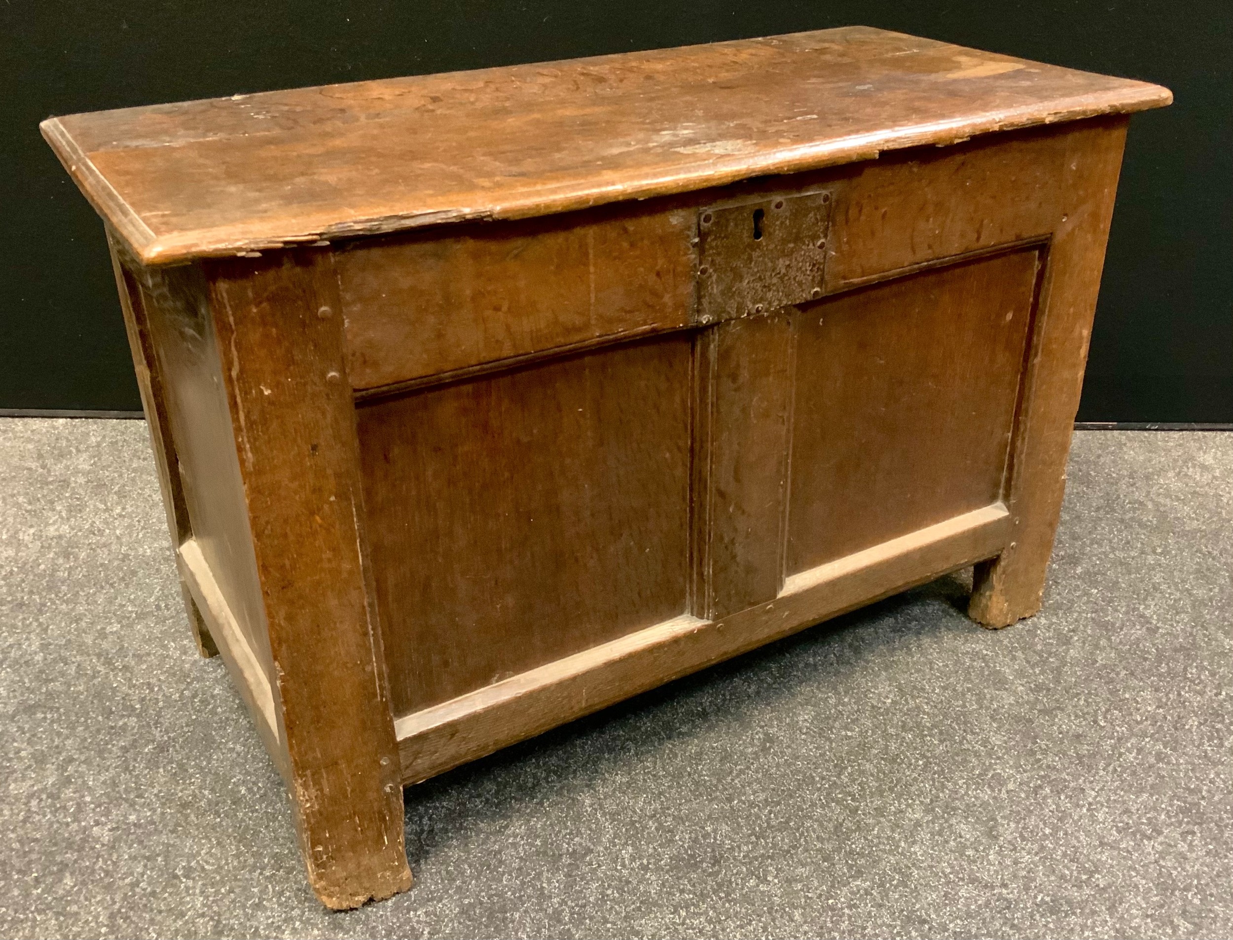 An early 18th century oak blanket chest, of small proportions, hinged cover above a pair of