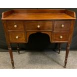 A George III style mahogany knee-hole desk, three quarter gallery rectangular top above a central