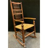 An early 19th century ash and elm rocking chair.