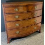 A Victorian mahogany bow-front chest of drawers, two short and three long graduated cockbeaded
