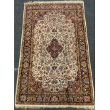 A fine hand made Kashan rug, multi tone floral motif, cream ground, 206cm x 132cm