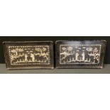 A pair of Chinese lacquered mother of pearl inlaid rectangular trays, each 25cm x 43cm (2)