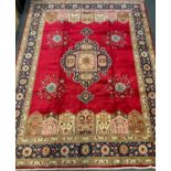 A fine Tabriz rug / carpet, the central medallion woven in shades of pale blue, pink, and deep