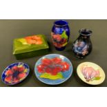 A Moorcroft pottery Anemone pattern vase, 9.5cm high, another Hibiscus; trinket box and cover;