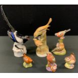 A Russian Lomonosov porcelain model Magpie; others Crown Staffordshire Flycatcher; Royal Worcester