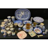 A Willow pattern meat plate; Dutch Delft mugs, bells, etc; commemorative mugs; carriage clock; brass