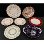 A Royal Crown Derby Royal Antoinette pattern wavy edge dinner plate; two similar dessert plates;