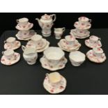 An Aynsley floral decorated part tea and coffee set inc coffee pot, cream and milk jugs, sugar
